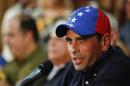 Venezuela's opposition leader and governor of Miranda state Henrique Capriles answers a question during a news conference in Caracas