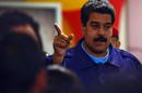 Venezuelan President Nicolas Maduro gestures as he arrives for a press conference in Caracas on February 21, 2014