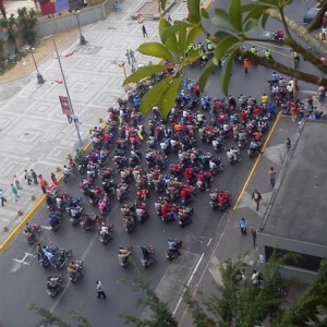 Pro-government “colectivos” on motorbikes follow behind National Police in central Caracas. Credit: Courtesy of an anonymous Twitter user