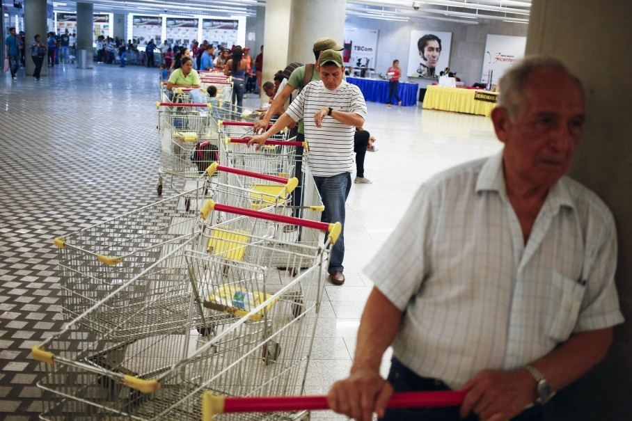 Customers line up to enter a state-run Bicentenario supermarket in Caracas, Venezuela. (Jorge Silva/Reuters)